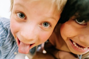 child sticking tongue out